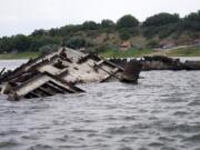 The wreckage of a WWII German warship is seen in the Danube river near Prahovo, Serbia, Monday, Aug. 29, 2022. The worst drought in Europe in decades has not only scorched farmland and hampered river traffic, it also has exposed a part of World War II history that had almost been forgotten. The hulks of dozens of German battleships have emerged from the mighty Danube River as its water levels dropped.