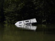 A camper is seen partly submerged under water in Carr Creek Lake on Wednesday, Aug. 3, 2022, near Hazard, Ky.