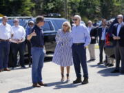 FILE - President Joe Biden and first lady Jill Biden talk with Kentucky Gov. Andy Beshear while they view flood damage in Lost Creek, Ky., Aug. 8, 2022. Beshear complained Thursday, Aug. 11, 2022, that the Federal Emergency Management Agency is denying too many requests for assistance in flood-ravaged eastern Kentucky, and urged those getting turned down to take their cases directly to agency representatives in the region.