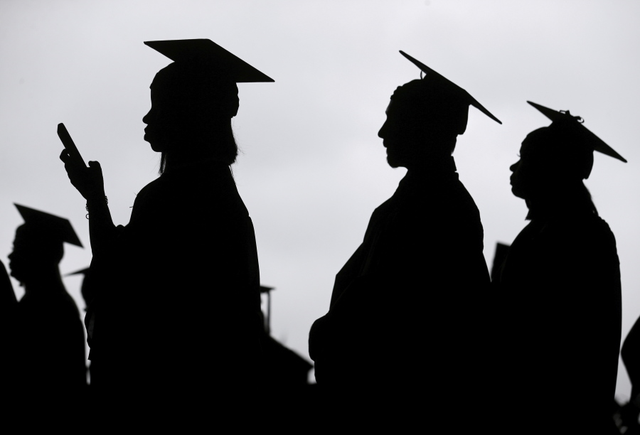 FILE - New graduates line up before the start of a community college commencement in East Rutherford, N.J., on May 17, 2018. President Joe Biden is expected to announce Wednesday Aug. 24, 2022 that many Americans can have up to $10,000 in federal student loan debt forgiven.