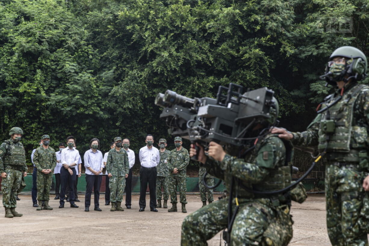 In this photo released by the Taiwan Ministry of National Defense, Taiwan's President Tsai Ing-wen watches soldiers operate equipment during a visit to a naval station on Penghu, an archipelago of several dozen islands off Taiwan's western coast on Tuesday, Aug. 30, 2022. Tsai told the self-ruled island's military units Tuesday to keep their cool in the face of daily warplane flights and warship maneuvers by rival China, saying that Taiwan will not allow Beijing to provoke a conflict. visit to the She also inspected a radar squadron, an air defense company, and a navy fleet.