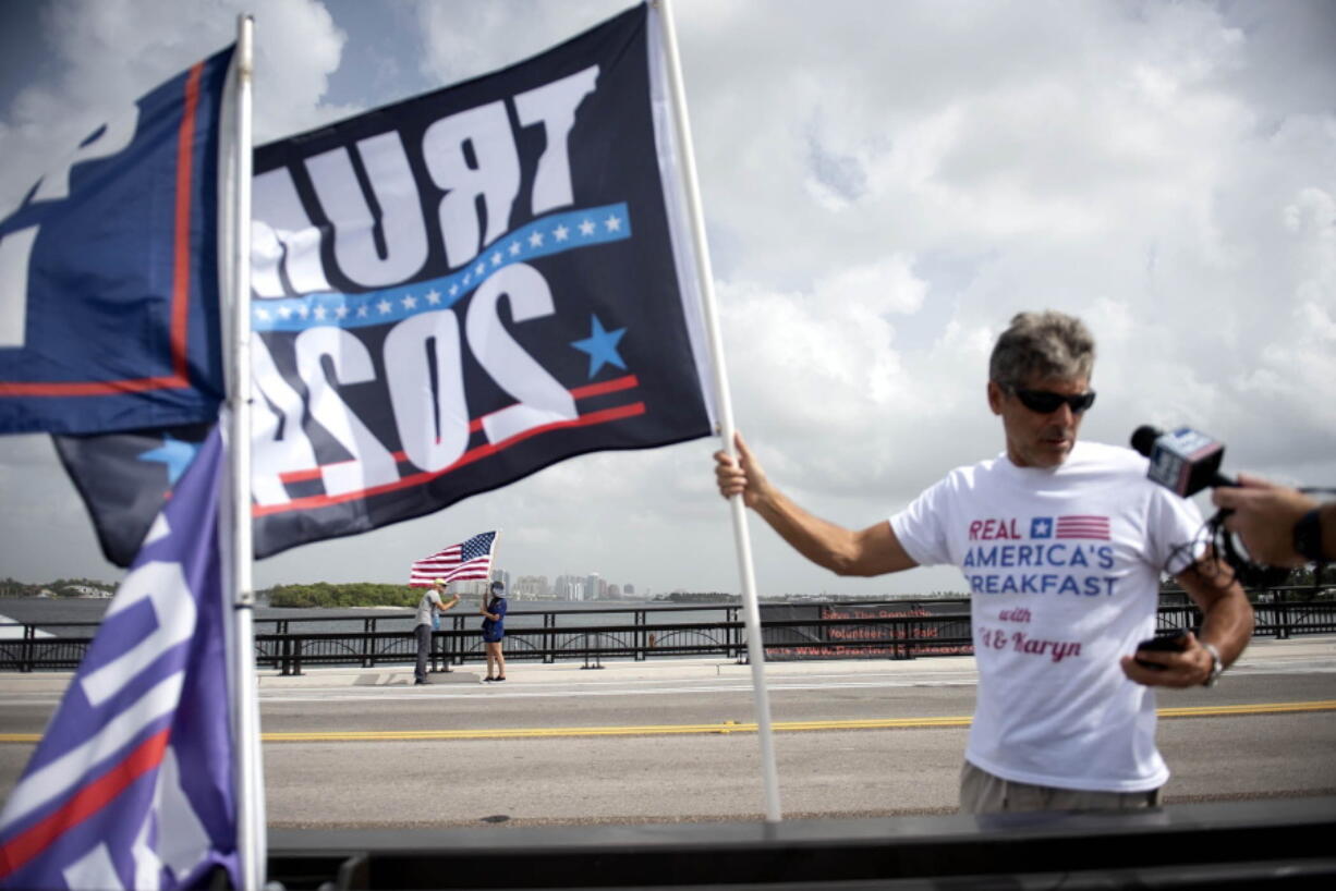 Supporters of Donald Trump, members of the media and law enforcement gather near Mar-a-Lago  in Palm Beach, Fla., on Tuesday, August 9, 2022.