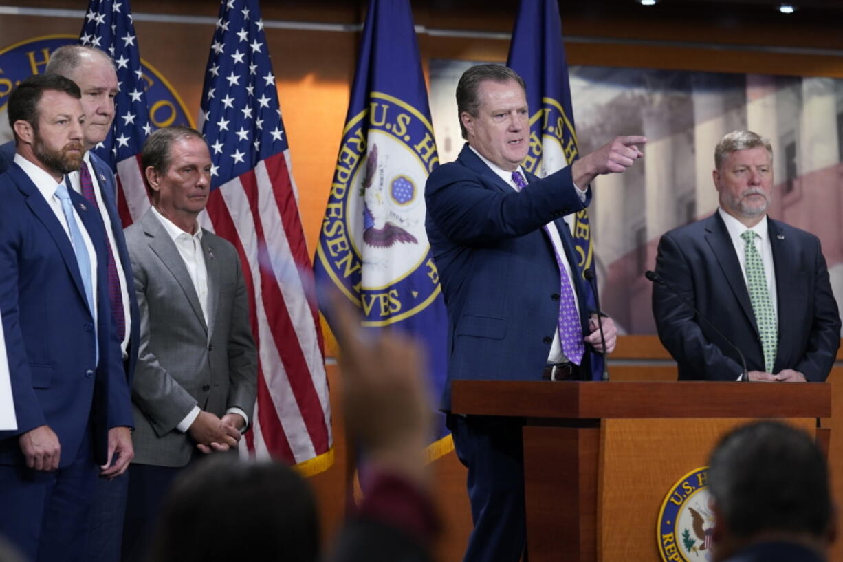 House Intelligence Committee ranking member Rep. Mike Turner, R-Ohio, second from right, joined by other Republicans on the committee, calls on a reporter during a news conference on Capitol Hill in Washington, Friday, Aug. 12, 2022, on the FBI serving a search warrant at former President Donald Trump's home in Florida.