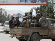 FILE - Taliban special force fighters arrive inside the Hamid Karzai International Airport after the U.S. military's withdrawal, in Kabul, Afghanistan, Aug. 31, 2021. A year after America's tumultuous and deadly withdrawal from Afghanistan, assessments of its impact are divided -- and largely along partisan lines.