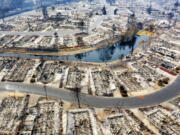 FILE - This aerial image taken with a drone shows homes leveled by the Almeda Fire line at Bear Lake Estates in Phoenix, Ore., on Sept. 15, 2020. A new map in Oregon that rated the wildfire risk of every tax lot in the state, labeling nearly 80,000 properties as high-risk, generated so much pushback from angry homeowners that officials abruptly retracted it, saying they had not done enough local outreach before publicizing the ambitious project.