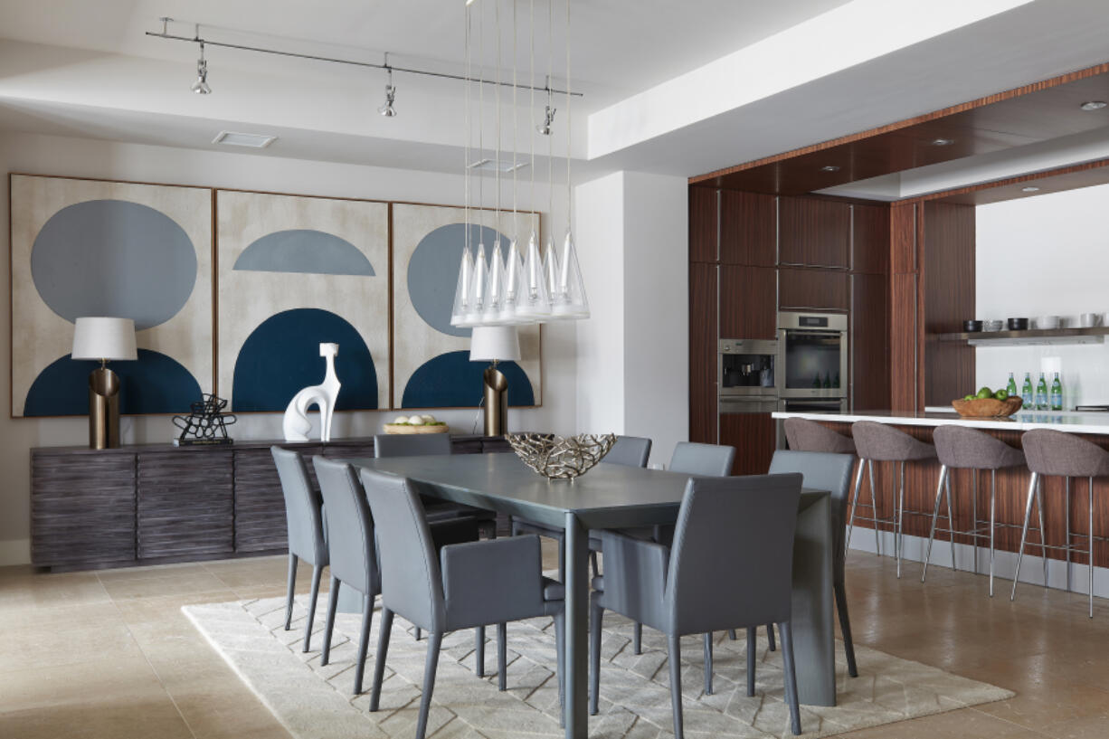 Blue art pieces make a strong statement in this dining space.