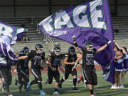 Heritage players take the field prior to their season-opening game against Hudson's Bay on Friday, Sept. 2, 2022.