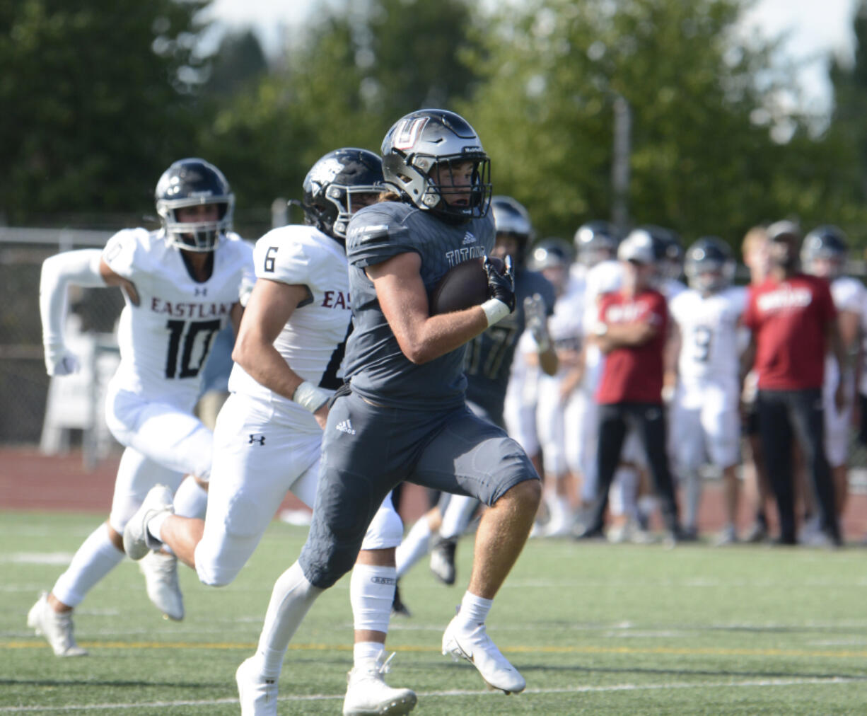 Union running back Cody Zehner races past Eastlake defenders en route to an 81-yard touchdown run in the first quarter Saturday.