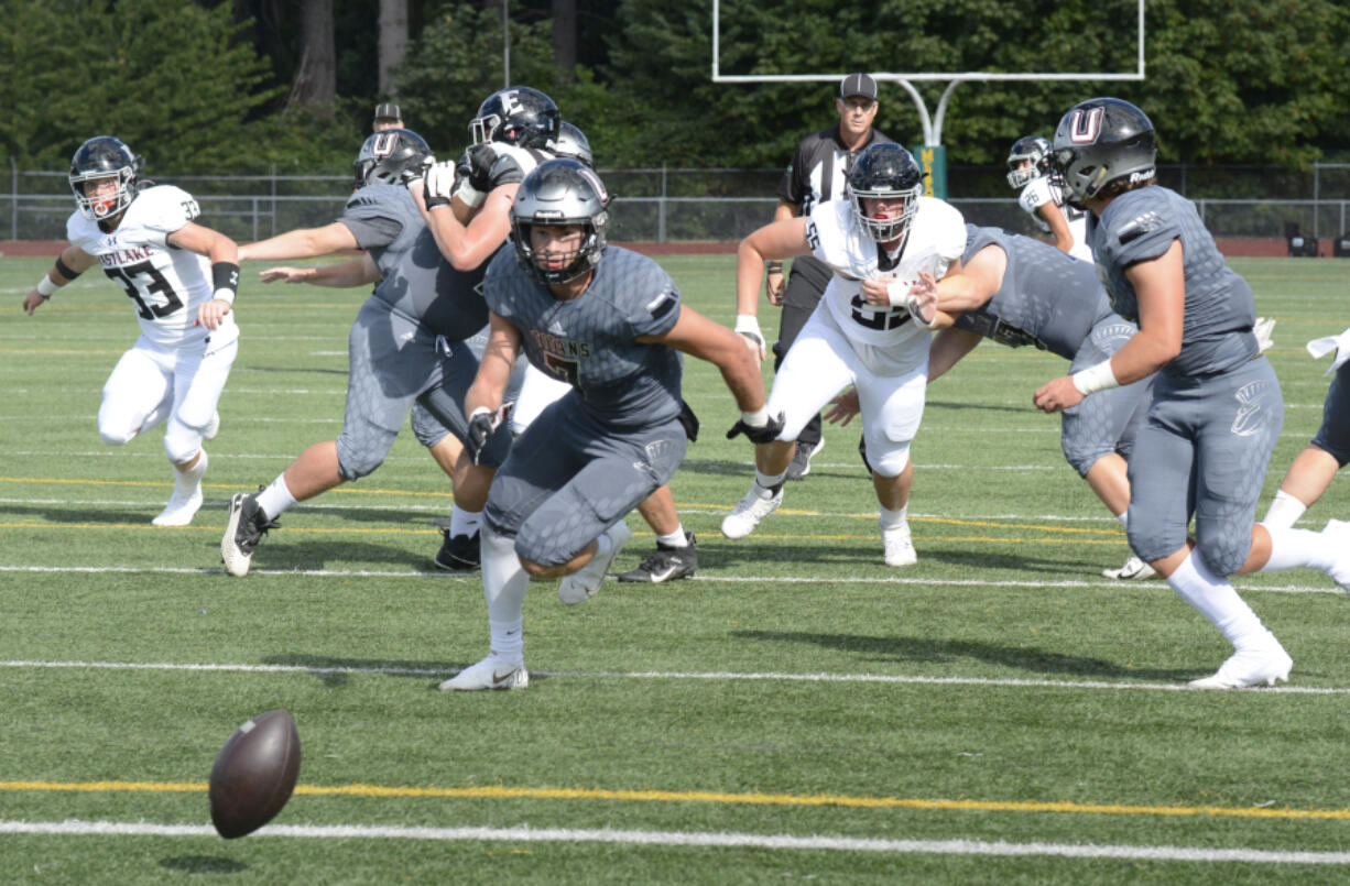 An off-target snap gets behind Union's offense during the first quarter of Saturday's game against Eastlake.