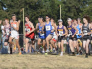 Runners in the boys varsity race take off in the Steve Mass Run-a-Ree cross country race on Friday at Hudson's Bay High School.