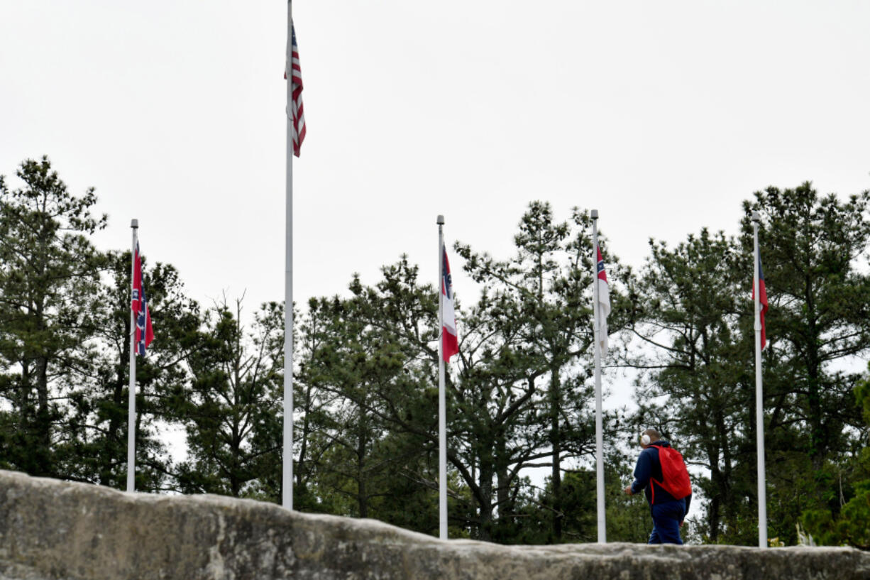 The four Confederate flags fly at the base of Stone Mountain's popular walk-up trail on Tuesday, April 20, 2021, in Georgia.