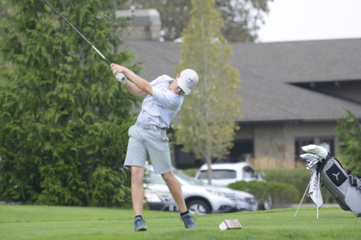 Columbia River's Noah Larson tees off the No. 5 tee at Camas Meadows during the Titan Cup on Monday.