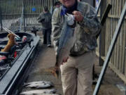 Outdoor reporter Terry Otto with a typical fall Chinook taken while fishing the mouth of the White Salmon River with guide Bill Monroe Jr.