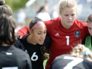 Prior to the start of the second half against Glacier Peak, Union captain Maya Woods (6) talks to her teammates in a huddle on Saturday, Sept. 17, 2022, at Union High School.