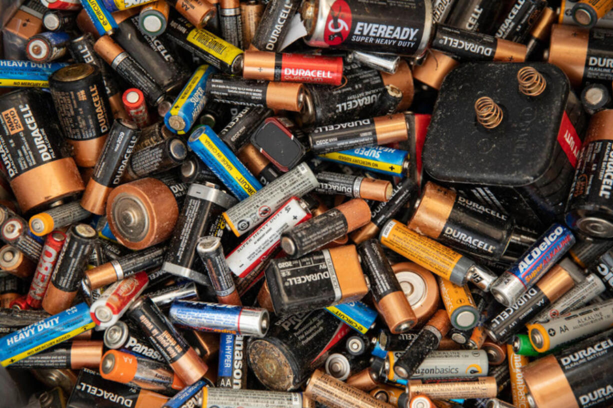 Alkaline batteries are separated and dumped into a bin at the North Seattle Hazardous Waste site, where people can drop off everything from car batteries to lithium-ion batteries, on Monday, Sept. 19, 2022. Washington state is increasing concerned over the number of batteries in use and is spurring a decade-old statewide effort to create a formal battery stewardship program in both Washington state, and more locally within King County.