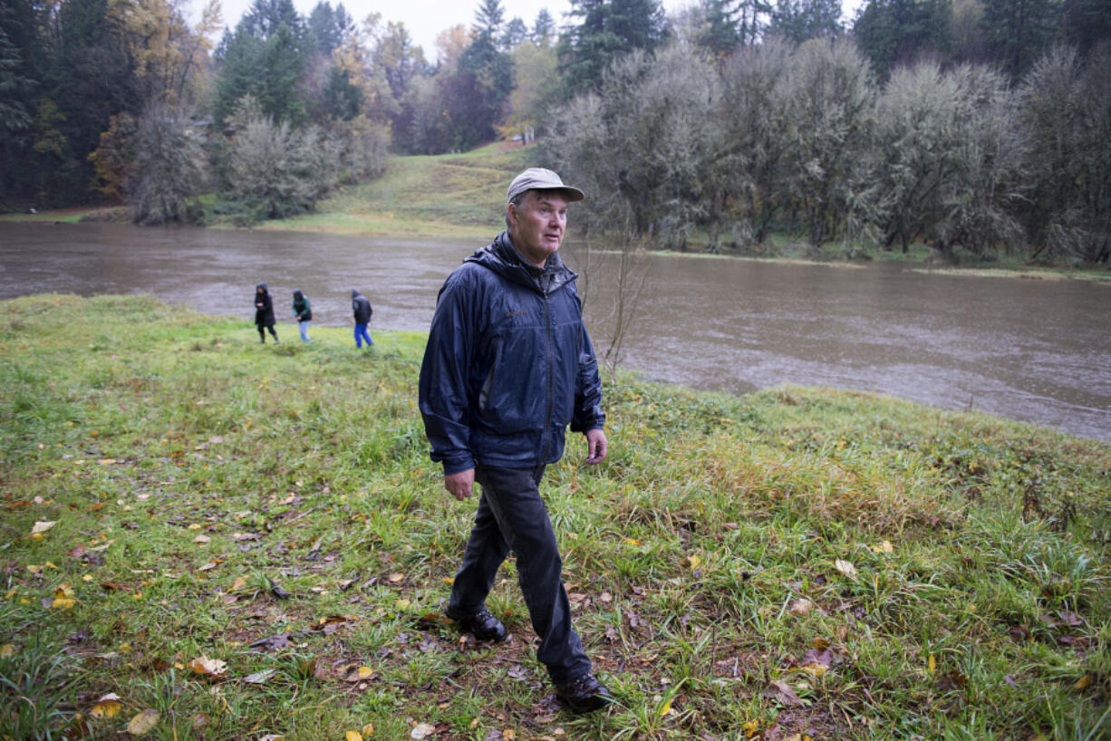 Bill Dygert, an independent land consultant who helped develop Clark County's Legacy Lands program, looks over land near La Center in 2015. Dygert died Aug. 27 at 71.