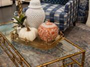 A white pumpkin is paired with neutral accessories for a beautiful traditional coffee table centerpiece.