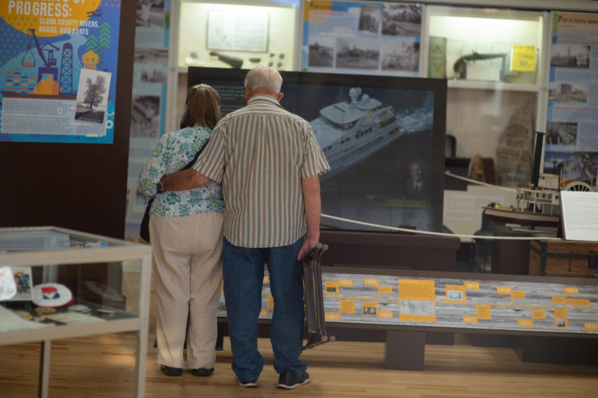 Chlovena Byrd and Owen Ratliff, friends for 30 years, look at exhibits before the "Fourth Plain Forward: Building Community" presentation began.