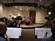 Russ Beacock, center, co-owner of Beacock Music, takes a seat behind the drum kit while playing with the Beacock Community Big Band. The Vancouver store is an institution and has been growing in recent years. It's expanding its territory farther with a new shop in Albany, Ore., set to open Nov. 1.