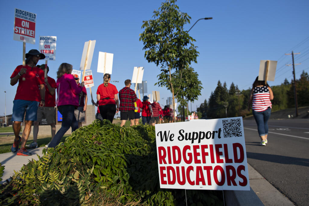 Union members and community members gather to strike after a deal has not been reached between the teachers union and school officials despite working without a contract since Sep. 1, as seen Friday morning, Sept. 9, 2022.