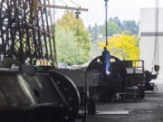 Workers construct the Y-shaped columns that will support Portland International Airport's new roof on Wednesday, at Thompson Metal Fab in Vancouver. The company is celebrating its 85th anniversary this year.