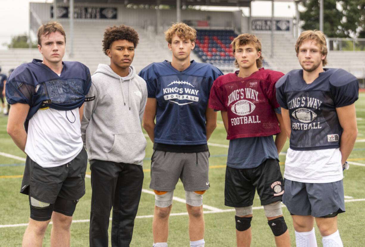 King's Way seniors Aidan Sweeney, from left, Jamison Duke, Alec Charlton, junior Brayden Schiefer and senior Marcus Whitney stand for a portrait Tuesday, Sept. 13, 2022, at King's Way Christian High School. The football team is 2-0 in its second year back competing at a varsity level.