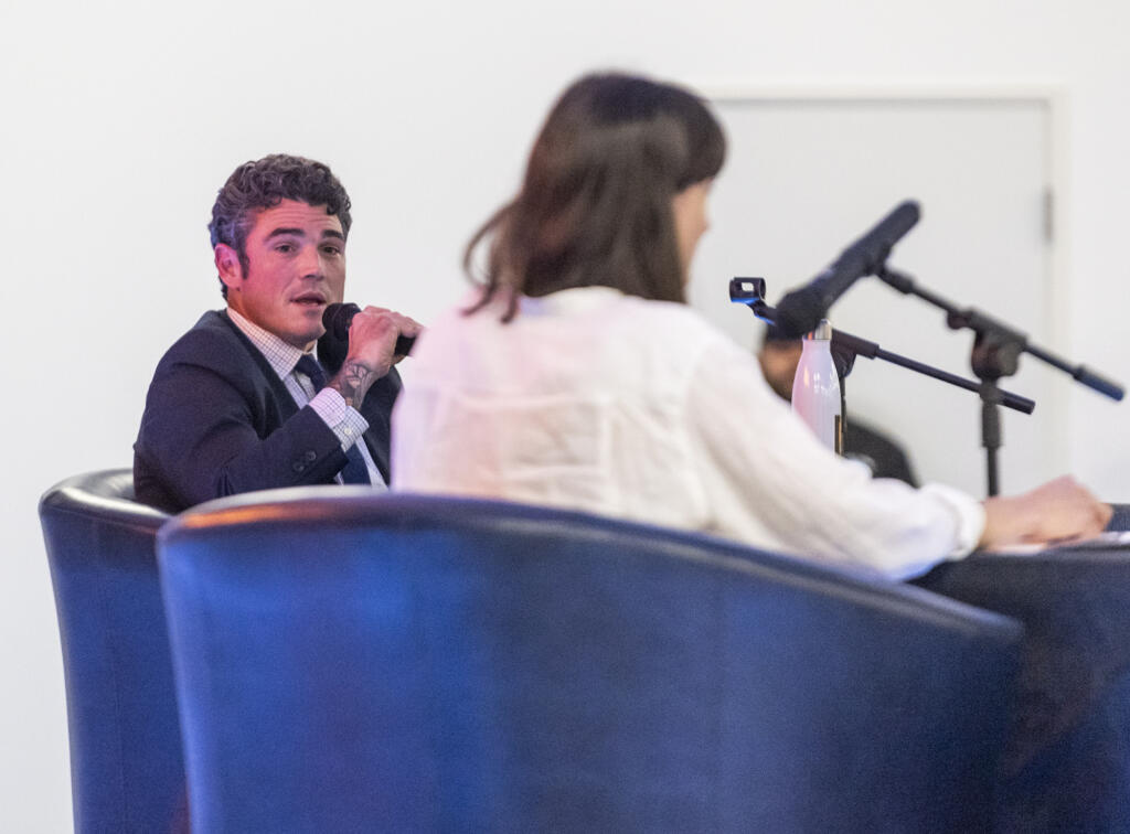 WA-03 candidate Joe Kent, left, addresses his opponent, Marie Gluesenkamp Perez, on Tuesday, Sept. 27, 2022, during a debate at RV Inn Style Resorts Convention Center.