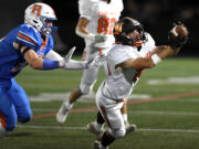 Washougal senior Talon Connelly, right, makes a diving reception Friday, Sept. 30, 2022, during a game between Washougal and Ridgefield at Ridgefield High School.