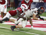 Oregon State linebacker and running back Jack Colletto heads in to the end zone for the game winning score as Fresno State defensive back Morice Norris tries to stop him during the second half of an NCAA college football game in Fresno, Calif., Saturday, Sept. 10, 2022.