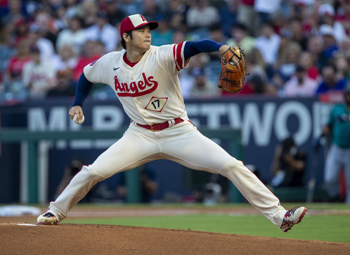 Los Angeles Angels starting pitcher Shohei Ohtani throws to a Seattle Mariners batter during the first inning of a baseball game in Anaheim, Calif., Saturday, Sept. 17, 2022.