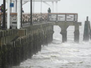 Waves crash along the Ballast Point Pier ahead of Hurricane Ian, Wednesday, Sept. 28, 2022, in Tampa, Fla. The U.S. National Hurricane Center says Ian's most damaging winds have begun hitting Florida's southwest coast as the storm approaches landfall.