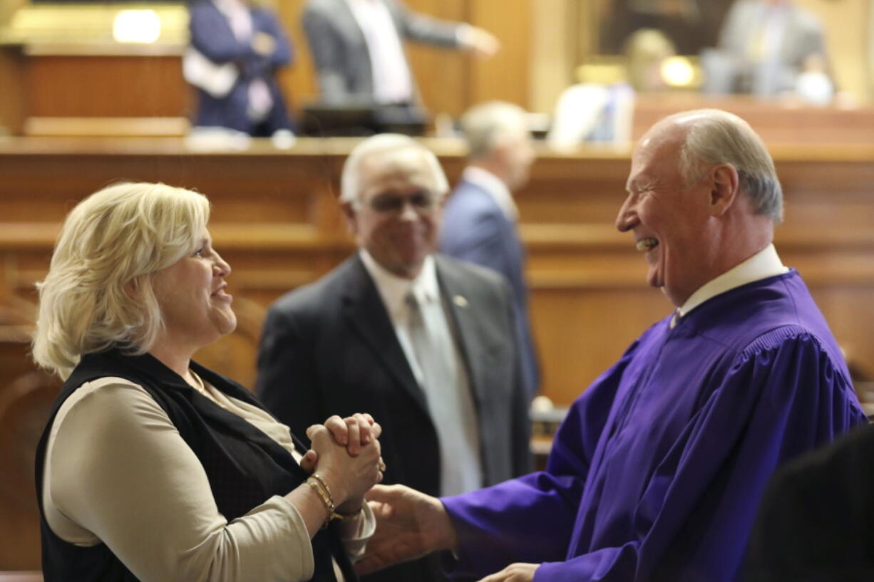 Republican South Carolina Sen. Penry Gustafson, left and Republican Senate President Thomas Alexander, right, talk before a debate on a bill banning abortion on Wednesday, Sept. 7, 2022, in Columbia, S.C.