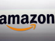 FILE - This Sept. 6, 2012, file photo, shows the Amazon logo in Santa Monica, Calif. The e-commerce and tech giant said Wednesday, Sept, 28, 2022, that it will release a device that can track sleeping patterns. The Halo Rise device will use no-contact sensors and artificial intelligence to measure a user's movement and breathing patterns.