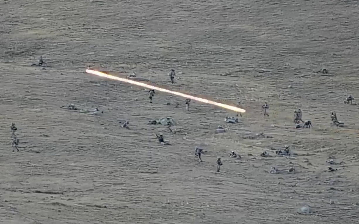 In this image taken from a YouTube footage released by Armenian Defense Ministry on Tuesday, Sept. 13, 2022, shows Azerbaijanian servicemen crossing the Armenian-Azerbaijani border and approaching the Armenian positions. Armenia's prime minister says that 49 soldiers have been killed in nighttime attacks by Azerbaijan.