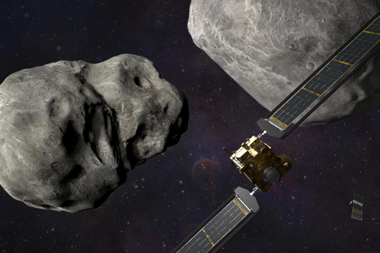 This illustration made available by Johns Hopkins APL and NASA depicts NASA's DART probe, foreground right, and Italian Space Agency's (ASI) LICIACube, bottom right, at the Didymos system before impact with the asteroid Dimorphos, left. DART is expected to zero in on the asteroid Monday, Sept. 26, 2022, intent on slamming it head-on at 14,000 mph. The impact should be just enough to nudge the asteroid into a slightly tighter orbit around its companion space rock.