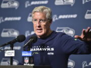 Seattle Seahawks head coach Pete Carroll talks to reporters after a preseason NFL football game against the Chicago Bears, Thursday, Aug. 18, 2022, in Seattle.