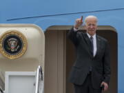 President Joe Biden gestures as he boards Air Force One Monday, Sept. 12, 2022, at Andrews Air Force Base, Md.