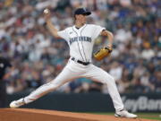 Seattle Mariners starting pitcher George Kirby works against the Atlanta Braves during the first inning of a baseball game, Saturday, Sept. 10, 2022, in Seattle.