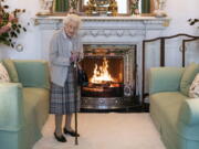 FILE - Britain's Queen Elizabeth II waits in the Drawing Room before receiving Liz Truss for an audience at Balmoral, in Scotland, Tuesday, Sept. 6, 2022, where Truss was invited to become Prime Minister and form a new government.