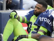 Seattle Seahawks safety Jamal Adams is taken off the field on a cart after an injury during the first half of an NFL football game against the Denver Broncos, Monday, Sept. 12, 2022, in Seattle.