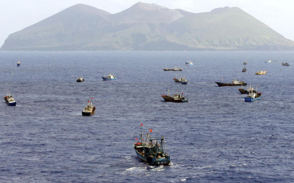 Foreign vessels, some of them have Chinese flags, fish near Torishima, Japan, on Oct. 31, 2014.