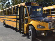 FILE - An electric school bus, leased by Beverly Public Schools in Beverly, Mass., rests in a bus yard, Oct. 21, 2021, in Beverly, Mass. The Environmental Protection Agency said Thursday, Sept. 29, that it will nearly double, to nearly $1 billion, funding available to states to acquire electric school buses, responding to what it calls overwhelming demand for cleaner school transportation.