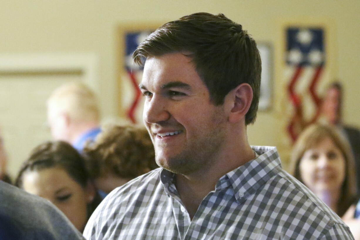 FILE - Alek Skarlatos, at the Douglas County Republican Party headquarters in Roseburg, Ore., May 15, 2018. Alek Skarlatos, a Republican nominee for Congress in Oregon, was cleared this week of violating campaign finance law. The development came months after a Democratic-aligned group filed a complaint with the Federal Election Commission, alleging he improperly funded his campaign with money from a nonprofit he also controlled. The use of the money was detailed in an Associated Press story last year, which formed the basis of the complaint filed by a Democrat-aligned group. Skarlatos campaign says he feels vindicated.