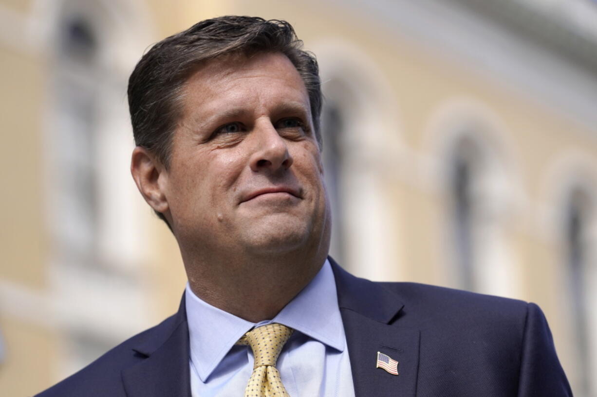 FILE - Republican gubernatorial candidate Geoff Diehl speaks to reporters outside the Statehouse, in Boston, March 21, 2022. Diehl, who has former President Donald Trump's endorsement, is going up against businessman Chris Doughty, a political newcomer, in the Republican primary for governor on Tuesday, Sept. 6.