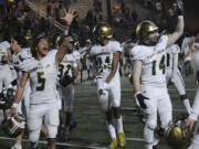 Evergreen’s Shaudez Gran (5) and Hayden Marcella waves to the Evergreen crowd after Evergreen’s 20-14 win over Mountain View at McKenzie Stadium on Friday, Sept. 30, 2022.