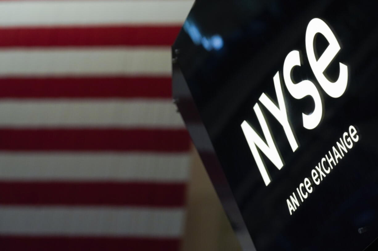 FILE - An NYSE sign is seen on the floor at the New York Stock Exchange in New York, on June 15, 2022.   Stocks are opening lower again on Wall Street, continuing a weak patch that has wiped out much of the gains the market made in July and early August. The S&P 500 lost about half a percent in the early going Thursday, Sept. 1.