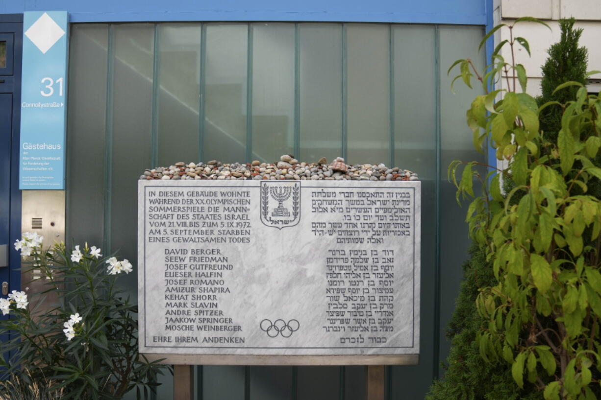 A memorial plaque for the eleven athletes from Israel and one German police officer were killed in a terrorist attack during the Olympic Games 1972, stands at the former accommodation of the Israeli team in the Olympic village in Munich, Germany, Saturday, Aug. 27, 2022. The families of 11 Israeli athletes killed by Palestinian attackers at the 1972 Summer Olympics and the German government are close to reaching a deal over the long-disputed amount of the compensation.