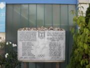 A memorial plaque for the eleven athletes from Israel and one German police officer were killed in a terrorist attack during the Olympic Games 1972, stands at the former accommodation of the Israeli team in the Olympic village in Munich, Germany, Saturday, Aug. 27, 2022. The families of 11 Israeli athletes killed by Palestinian attackers at the 1972 Summer Olympics and the German government are close to reaching a deal over the long-disputed amount of the compensation.