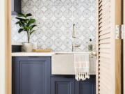 This image provided by Hillary Stamm shows a laundry room. Laundry rooms no longer need to be hidden. Hillary Stamm of HMS Interior Design in El Segundo, California, says: "This is a space you aren't in for hours (let's hope!) so have some fun. A textured tile or an intricate design with a splash of color can work wonders here.".