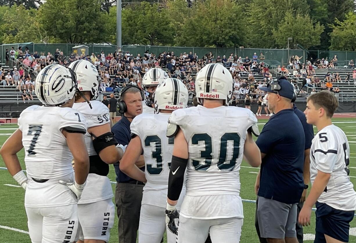 Skyview head coach Steve Kizer, second from left, talks to his defense during a timeout in the first half against Jesuit on Friday at Jesuit High School.